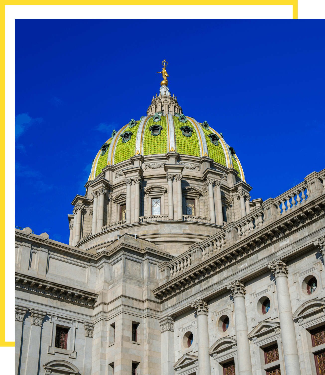 Ornate green dome against blue sky